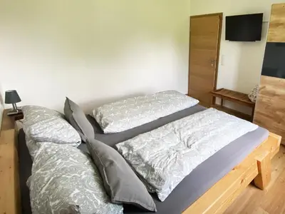 Ein Bett oder Betten in einem Zimmer der Unterkunft Ferienwohnung an der Jodquelle