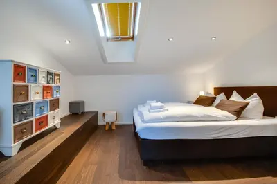 Ein Bett oder Betten in einem Zimmer der Unterkunft Ferienhaus Seehof mit Sauna & offenem Kamin