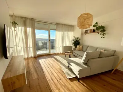 Ein Sitzbereich in der Unterkunft Best Butler Skyline Lodge City Apartment Netflix