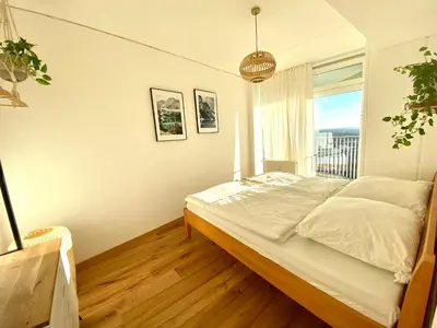 Ein Bett oder Betten in einem Zimmer der Unterkunft Best Butler Skyline Lodge City Apartment Netflix