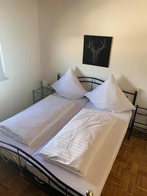 Ein Bett oder Betten in einem Zimmer der Unterkunft Ferienwohnung Maier Schliersee Neuhaus
