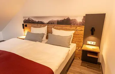Ein Bett oder Betten in einem Zimmer der Unterkunft Pension Sewald