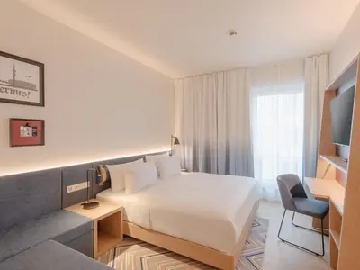 Ein Bett oder Betten in einem Zimmer der Unterkunft Hampton By Hilton Munich City North
