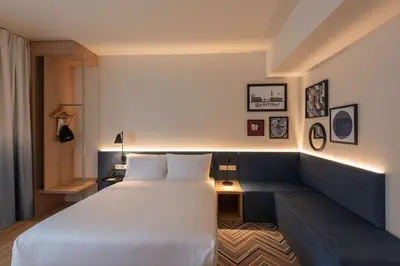 Ein Bett oder Betten in einem Zimmer der Unterkunft Hampton By Hilton Munich City North