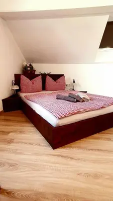 Ein Bett oder Betten in einem Zimmer der Unterkunft Ferienwohnung Weber Alpenglück