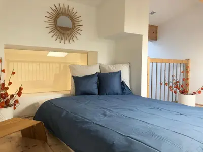 Ein Bett oder Betten in einem Zimmer der Unterkunft Galeriestudio - Zentral in Gmund