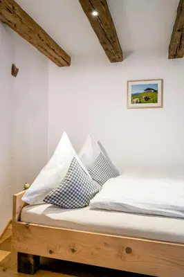Ein Bett oder Betten in einem Zimmer der Unterkunft Naderbauer-Hof