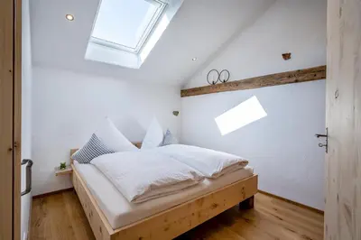 Ein Bett oder Betten in einem Zimmer der Unterkunft Naderbauer-Hof