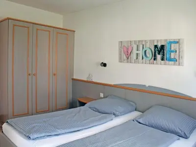 Ein Bett oder Betten in einem Zimmer der Unterkunft Ferienhaus Nr 14, Typ A, Feriendorf Hochbergle, Allgäu