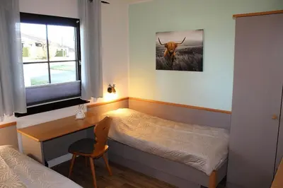 Ein Bett oder Betten in einem Zimmer der Unterkunft Ferienhaus Nr 14, Typ A, Feriendorf Hochbergle, Allgäu