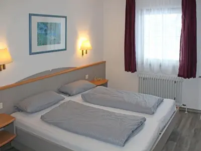 Ein Bett oder Betten in einem Zimmer der Unterkunft Ferienhaus Nr 3, Typ A, Feriendorf Hochbergle, Allgäu