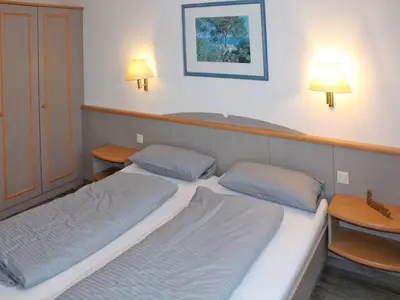 Ein Bett oder Betten in einem Zimmer der Unterkunft Ferienhaus Nr 3, Typ A, Feriendorf Hochbergle, Allgäu