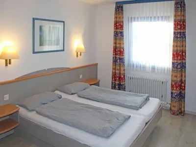 Ein Bett oder Betten in einem Zimmer der Unterkunft Ferienhaus Nr 53, Typ A, Feriendorf Hochbergle, Allgäu