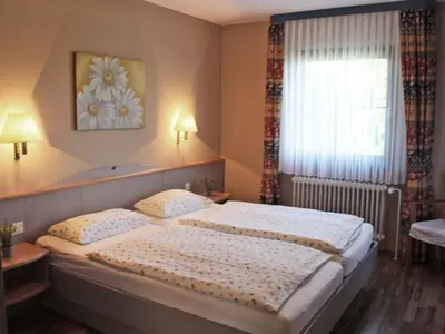 Ein Bett oder Betten in einem Zimmer der Unterkunft Ferienhaus Nr 55, Typ A, Feriendorf Hochbergle, Allgäu