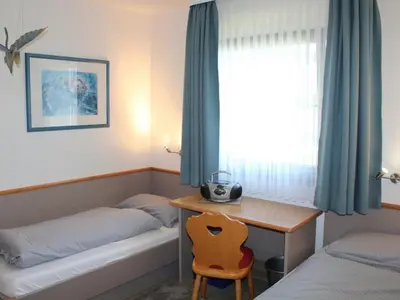 Ein Bett oder Betten in einem Zimmer der Unterkunft Ferienhaus Nr 59, Typ A, Feriendorf Hochbergle, Allgäu