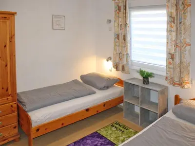 Ein Bett oder Betten in einem Zimmer der Unterkunft Ferienhaus Nr 134, Typ A, Feriendorf Hochbergle, Allgäu