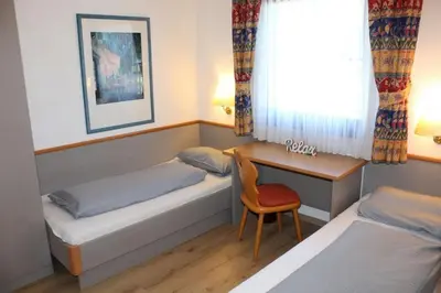 Ein Bett oder Betten in einem Zimmer der Unterkunft Ferienhaus Nr 48, Typ A, Feriendorf Hochbergle, Allgäu