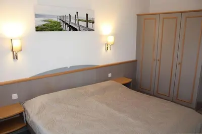 Ein Bett oder Betten in einem Zimmer der Unterkunft Ferienhaus Nr 49, Typ E, Feriendorf Hochbergle, Allgäu