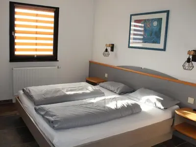 Ein Bett oder Betten in einem Zimmer der Unterkunft Ferienhaus Nr 67, Typ A, Feriendorf Hochbergle, Allgäu