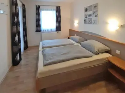 Ein Bett oder Betten in einem Zimmer der Unterkunft Ferienhaus Nr 62, Typ E, Feriendorf Hochbergle, Allgäu