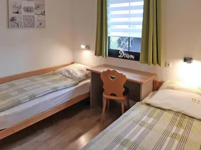 Ein Bett oder Betten in einem Zimmer der Unterkunft Ferienhaus Nr 62, Typ E, Feriendorf Hochbergle, Allgäu