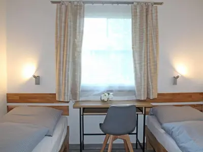 Ein Bett oder Betten in einem Zimmer der Unterkunft Ferienhaus Nr 80, Typ A, Feriendorf Hochbergle, Allgäu