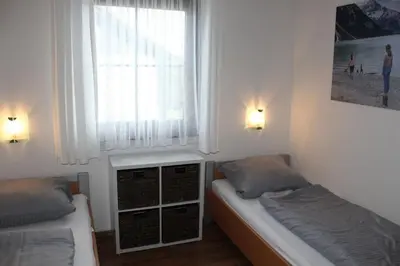 Ein Bett oder Betten in einem Zimmer der Unterkunft Ferienhaus Nr 22, Typ B, Feriendorf Hochbergle, Allgäu