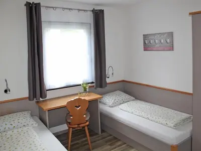 Ein Bett oder Betten in einem Zimmer der Unterkunft Ferienhaus Nr 86, Typ B, Feriendorf Hochbergle, Allgäu
