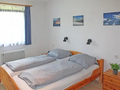 Ein Bett oder Betten in einem Zimmer der Unterkunft Ferienhaus Nr 13, Typ A, Feriendorf Hochbergle, Allgäu