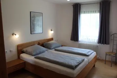 Ein Bett oder Betten in einem Zimmer der Unterkunft Ferienhaus Nr 57, Typ C, Feriendorf Hochbergle, Allgäu