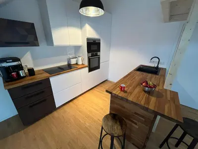 Küche/Küchenzeile in der Unterkunft Traumhafte neue Dachterrassenwohnung am Soyener See