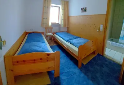 Ein Bett oder Betten in einem Zimmer der Unterkunft Ferienwohnung Nr 3, Lechbruck-Gründl, Allgäu