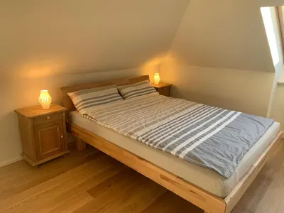 Ein Bett oder Betten in einem Zimmer der Unterkunft Apartment Wendelsteinblick