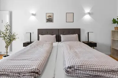 Ein Bett oder Betten in einem Zimmer der Unterkunft Flatista Homes - Hirschgarten
