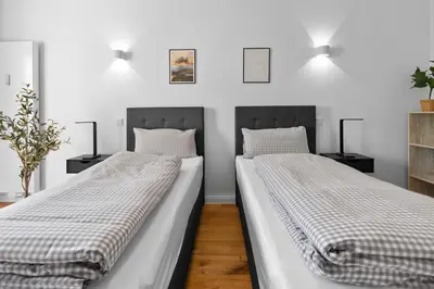 Ein Bett oder Betten in einem Zimmer der Unterkunft Flatista Homes - Hirschgarten