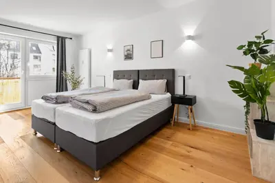 Ein Bett oder Betten in einem Zimmer der Unterkunft Flatista Homes - Hirschgarten