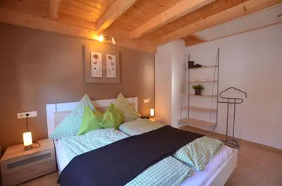 Ein Bett oder Betten in einem Zimmer der Unterkunft Feriendorf Via Claudia Haus 100 Dominique