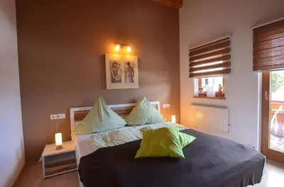 Ein Bett oder Betten in einem Zimmer der Unterkunft Feriendorf Via Claudia Haus 100 Dominique