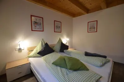 Ein Bett oder Betten in einem Zimmer der Unterkunft Feriendorf Via Claudia Haus 42 Onkel Leo