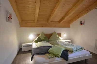 Ein Bett oder Betten in einem Zimmer der Unterkunft Feriendorf Via Claudia Haus 42 Onkel Leo