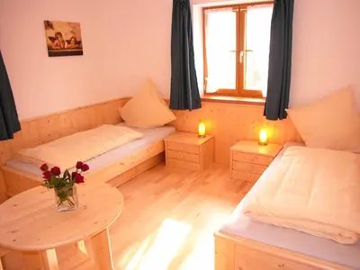 Ein Bett oder Betten in einem Zimmer der Unterkunft Gästehaus Weissenbauer