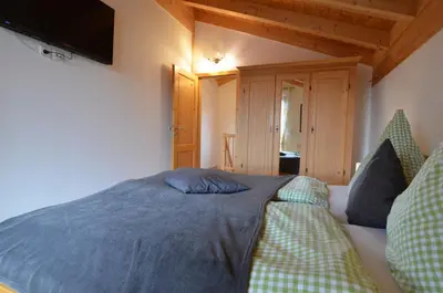 Ein Bett oder Betten in einem Zimmer der Unterkunft Feriendorf Via Claudia Haus 62 Bernhard