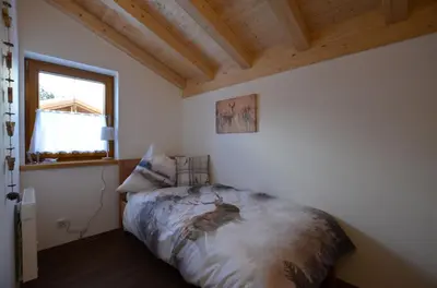 Ein Bett oder Betten in einem Zimmer der Unterkunft Feriendorf Via Claudia Haus 70 Augusta