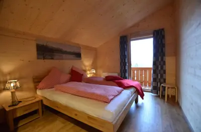 Ein Bett oder Betten in einem Zimmer der Unterkunft Feriendorf Via Claudia Haus 74 Allgäuglück