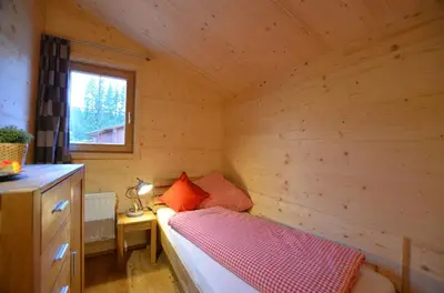 Ein Bett oder Betten in einem Zimmer der Unterkunft Feriendorf Via Claudia Haus 74 Allgäuglück