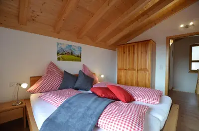 Ein Bett oder Betten in einem Zimmer der Unterkunft Feriendorf Via Claudia Haus 82 Alpensee