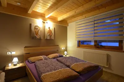 Ein Bett oder Betten in einem Zimmer der Unterkunft Feriendorf Via Claudia Haus 99 Julia