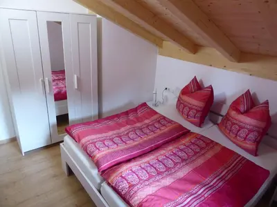 Ein Bett oder Betten in einem Zimmer der Unterkunft Feriendorf Via Claudia Haus 78 Platzhirsch