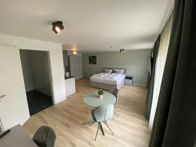 Ein Bett oder Betten in einem Zimmer der Unterkunft Snooze Apartments Alling