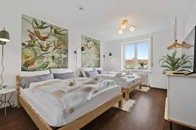 Ein Bett oder Betten in einem Zimmer der Unterkunft Arbio I Premium Penthouse Apartment Augsburg